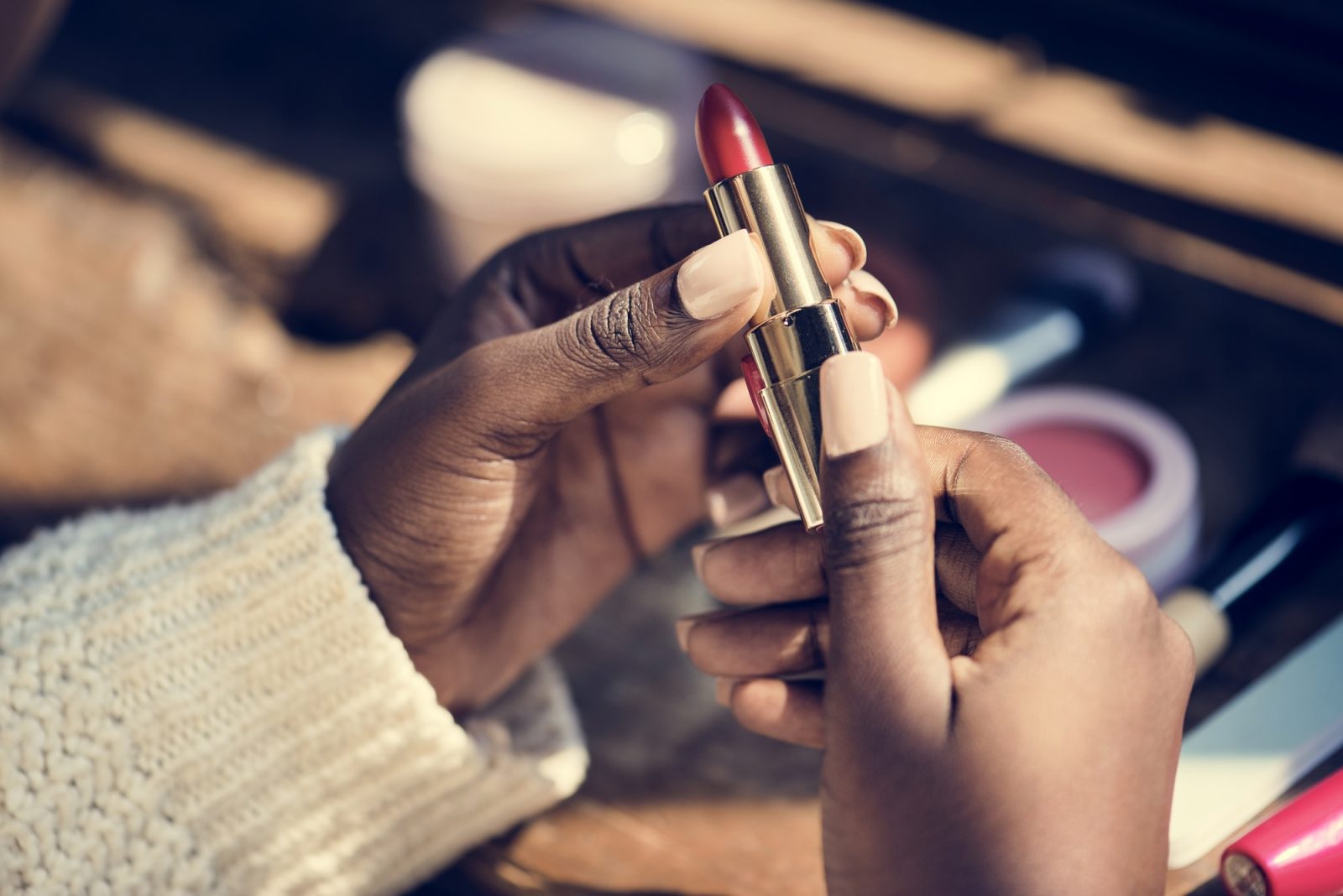 Woman using lipstick