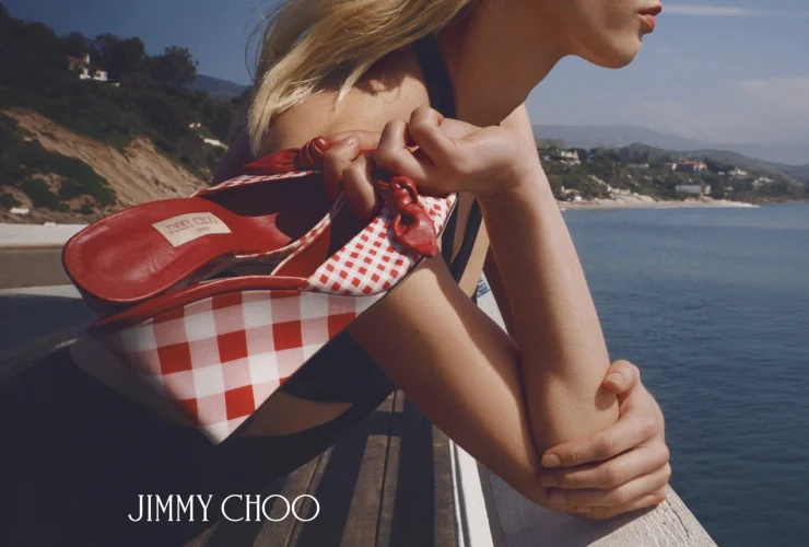 Jimmy Choo Riviera 2026 campaign featuring raffia and gingham accessories in a Malibu setting