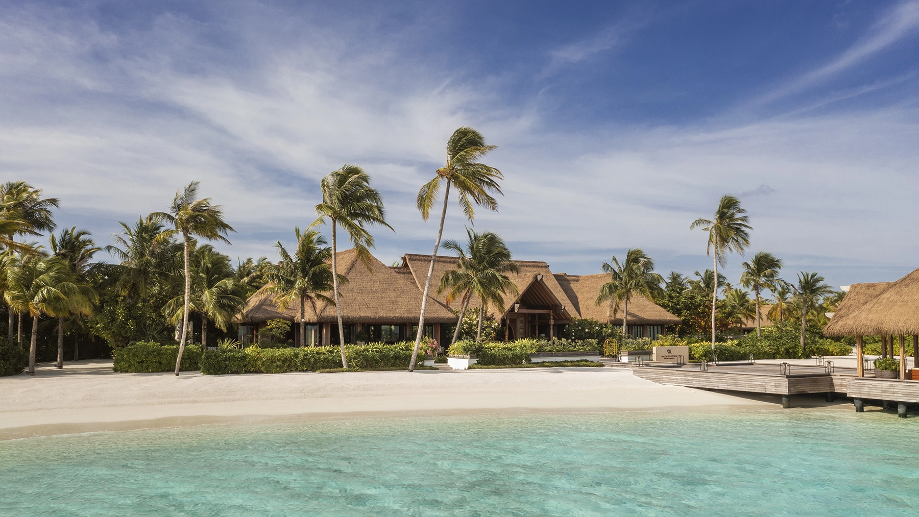 Waldorf Astoria Maldives Ithaafushi welcome pavilion at golden hour