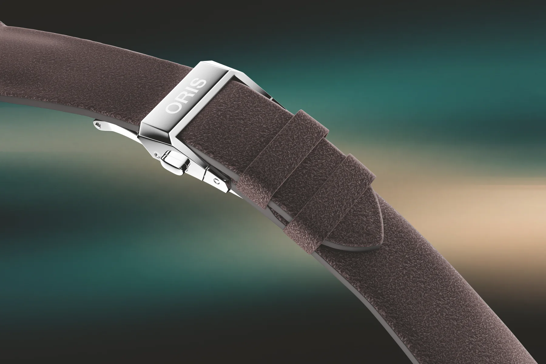 The Oris Hölstein Edition 2026 worn on the wrist with its grey suede strap