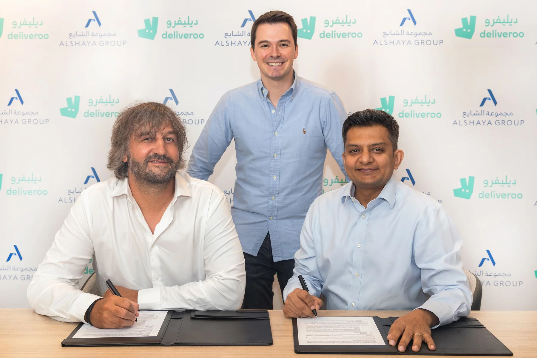 Deliveroo Middle East and Alshaya Group leadership at the partnership signing for on-demand retail delivery in Kuwait and the UAE