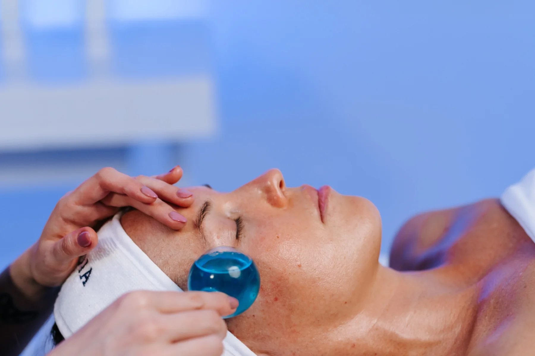 A professional skincare facial in a calm studio