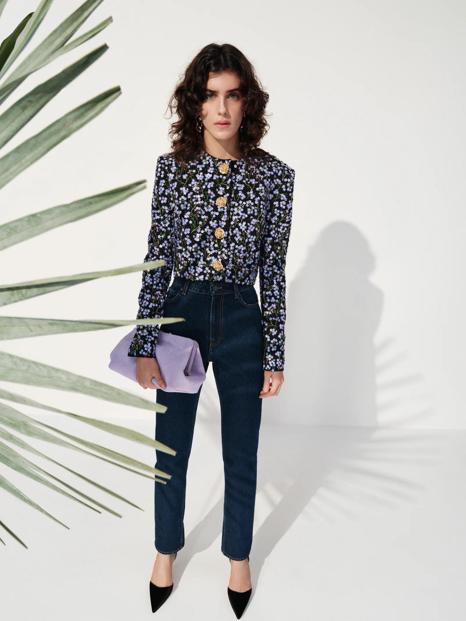 Navy floral blouse worn with refined denim from Carolina Herrera Resort 2027