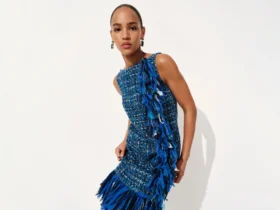 Carolina Herrera Resort 2027 campaign banner with ultramarine fringe dress