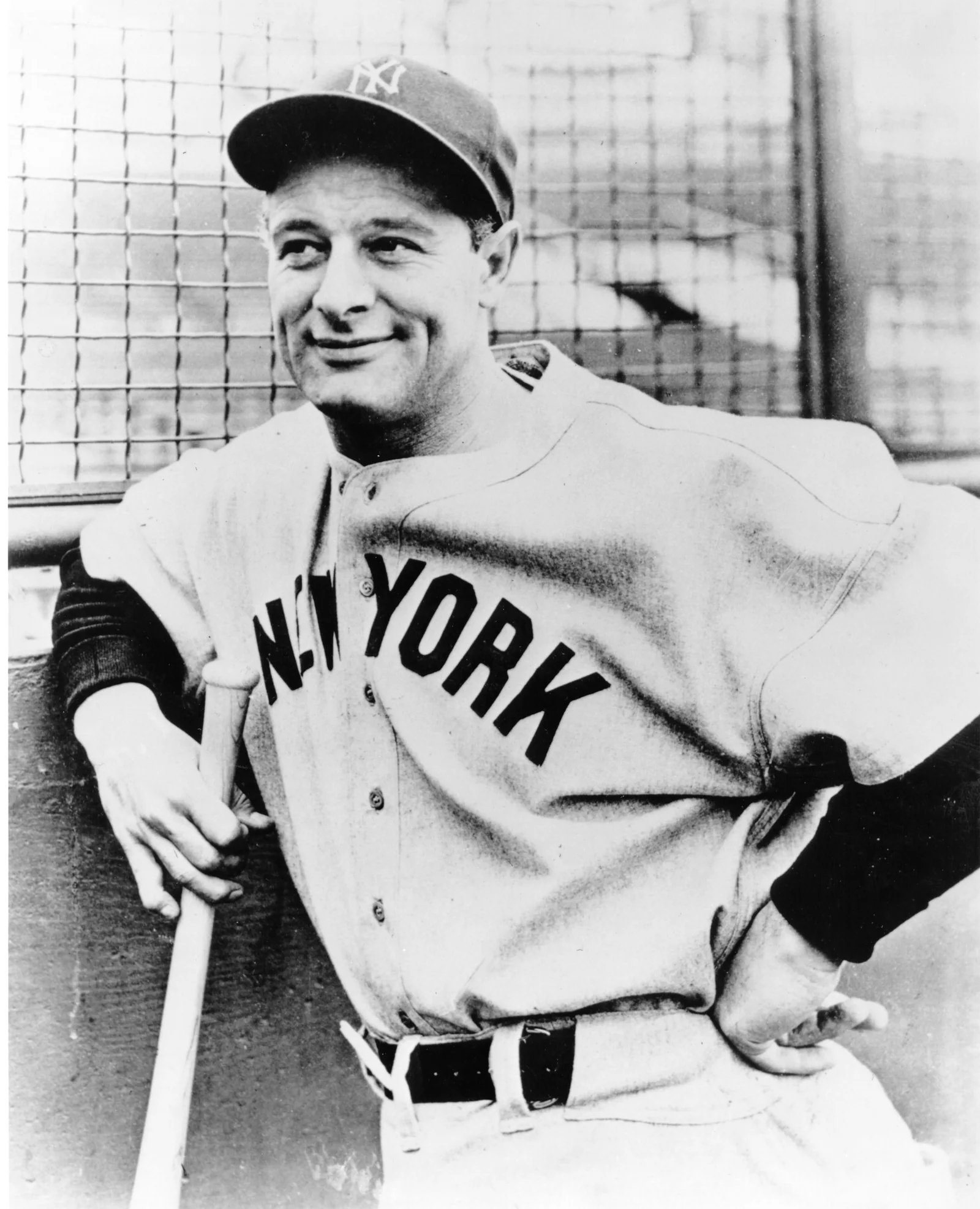 A vintage black and white portrait of baseball legend Lou Gehrig