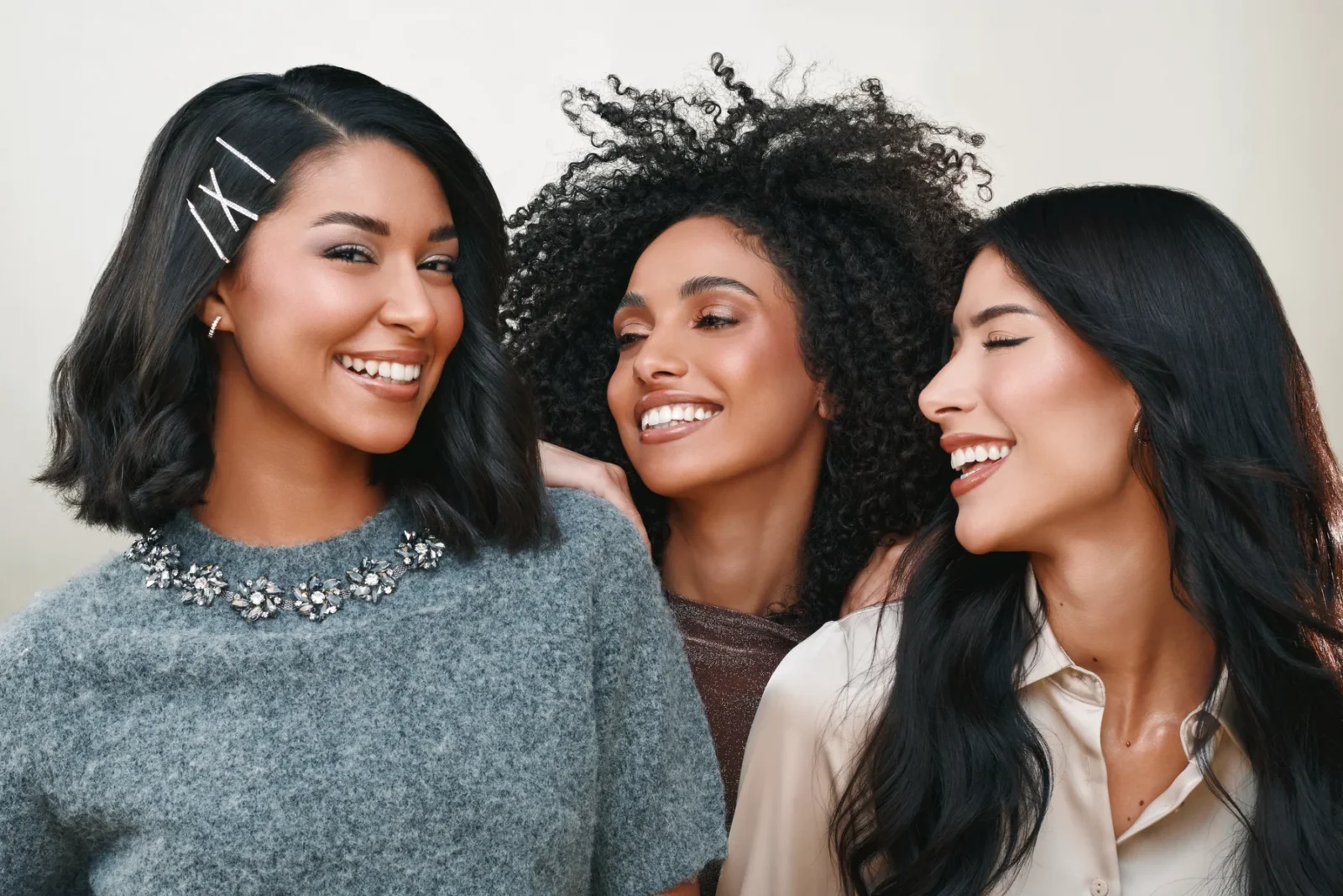 Three friends together in the MY SEPHORA beauty campaign by Sephora Middle East, one wearing a Sephora hair clip