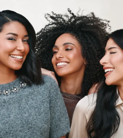 Three friends together in the MY SEPHORA beauty campaign by Sephora Middle East, one wearing a Sephora hair clip