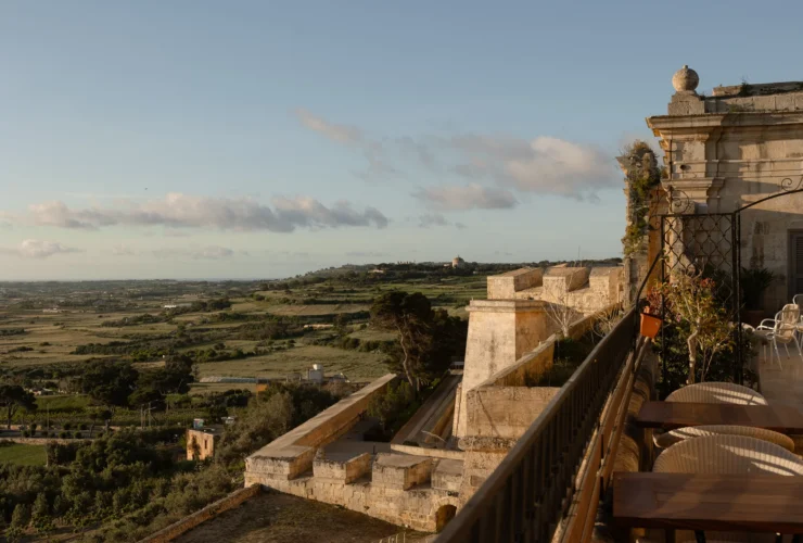 The Xara Palace on the medieval bastions of Mdina at dusk