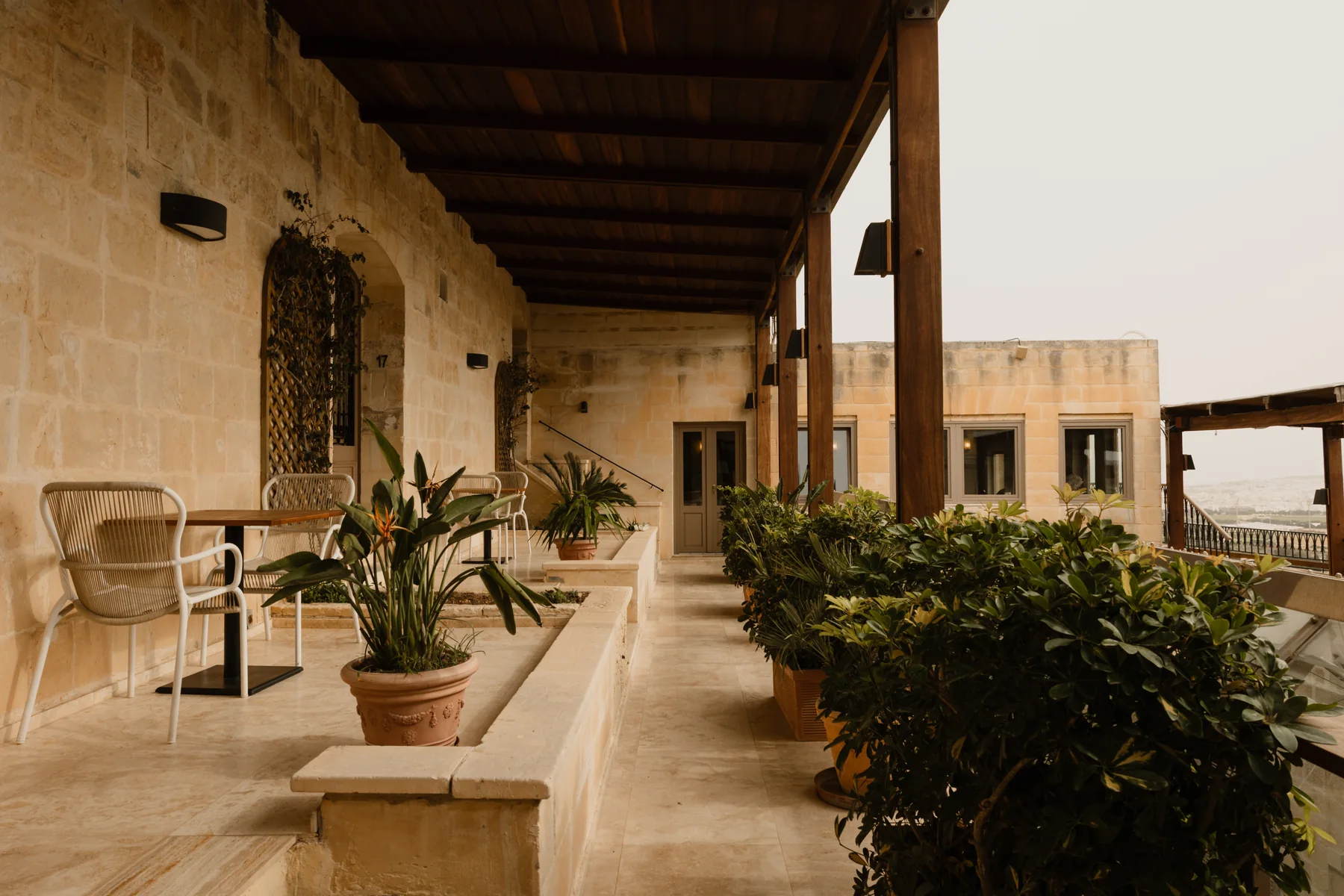 A plant-filled arched loggia at The Xara Palace