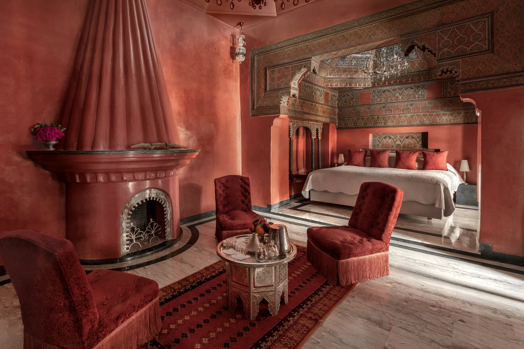 A red suite with a fireplace at La Sultana Marrakech
