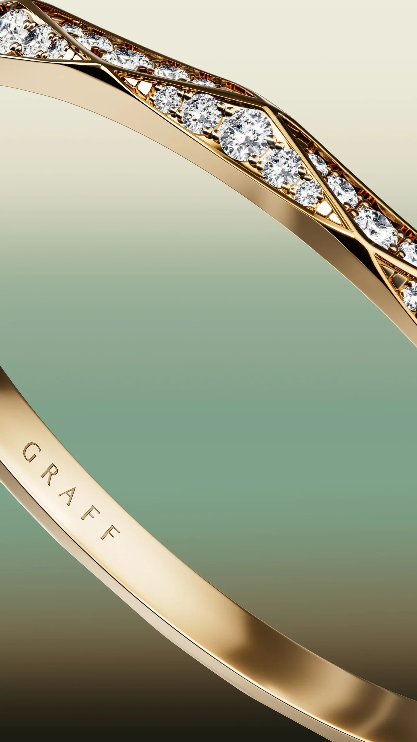 A Laurence Graff Signature faceted gold bangle set with pavé diamonds