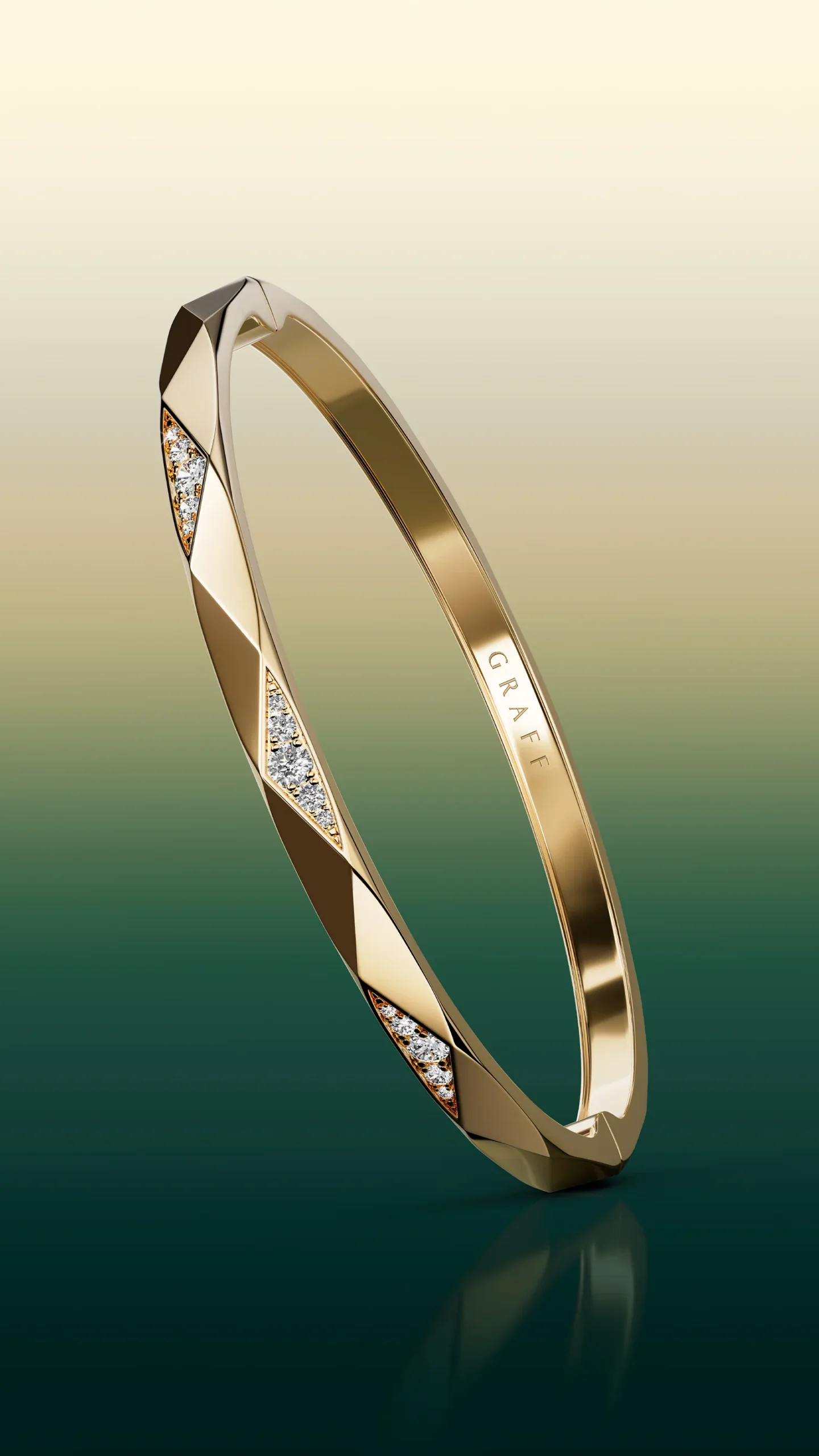 A Laurence Graff Signature faceted yellow gold bangle