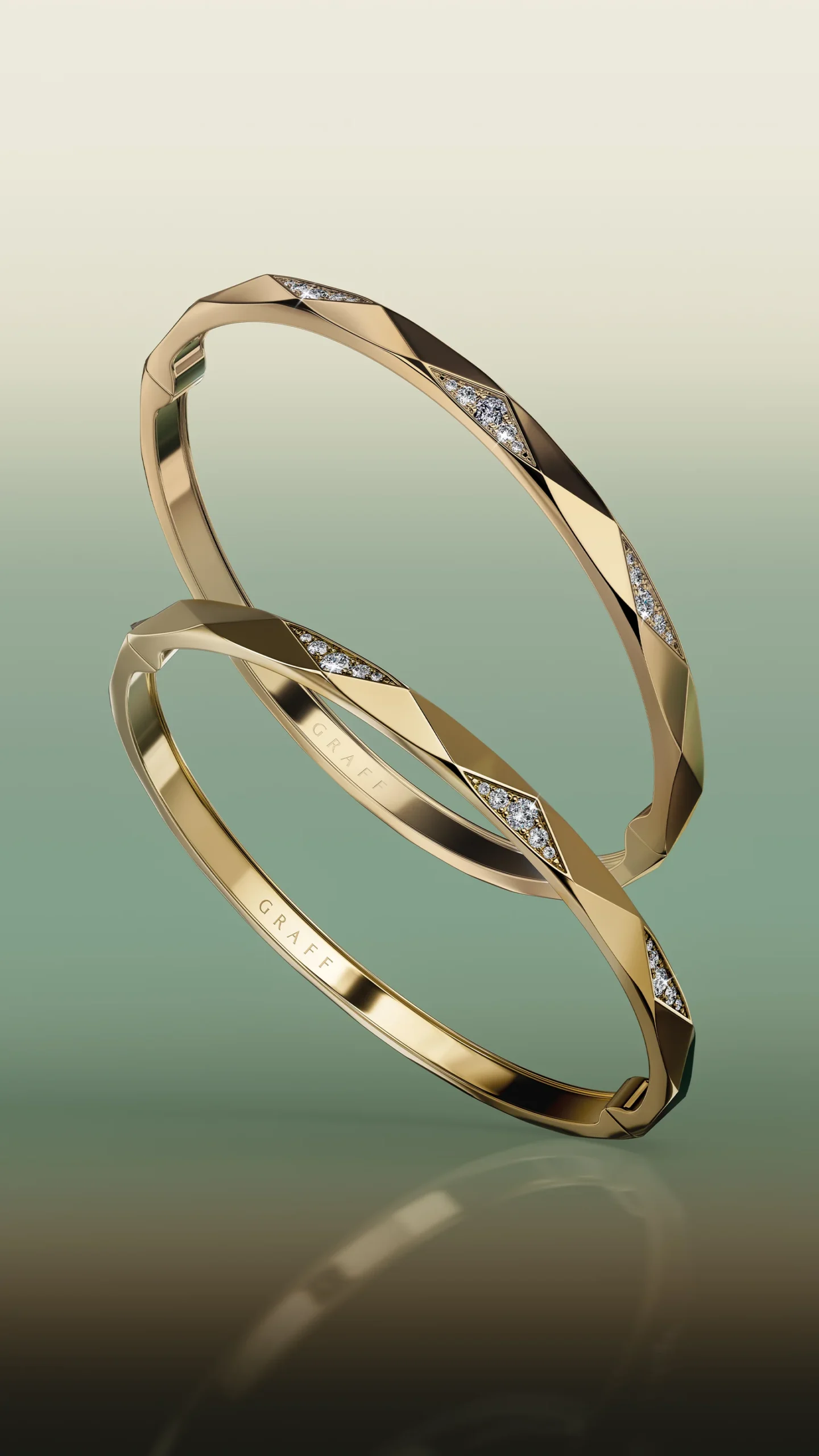 A pair of Laurence Graff Signature faceted yellow gold bangles