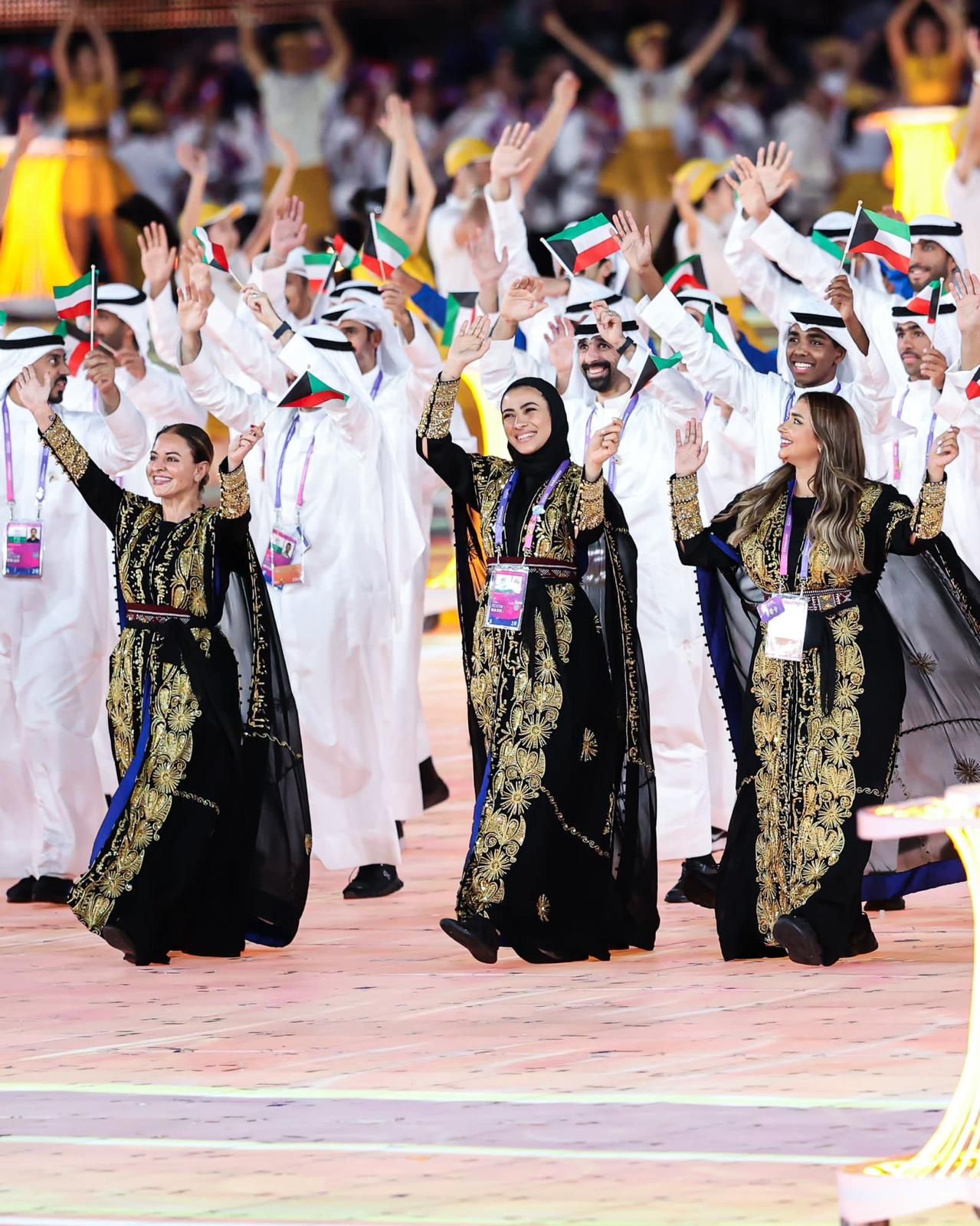 Kuwaiti athletes in black and gold Muhra thoubs at the Olympic opening ceremony