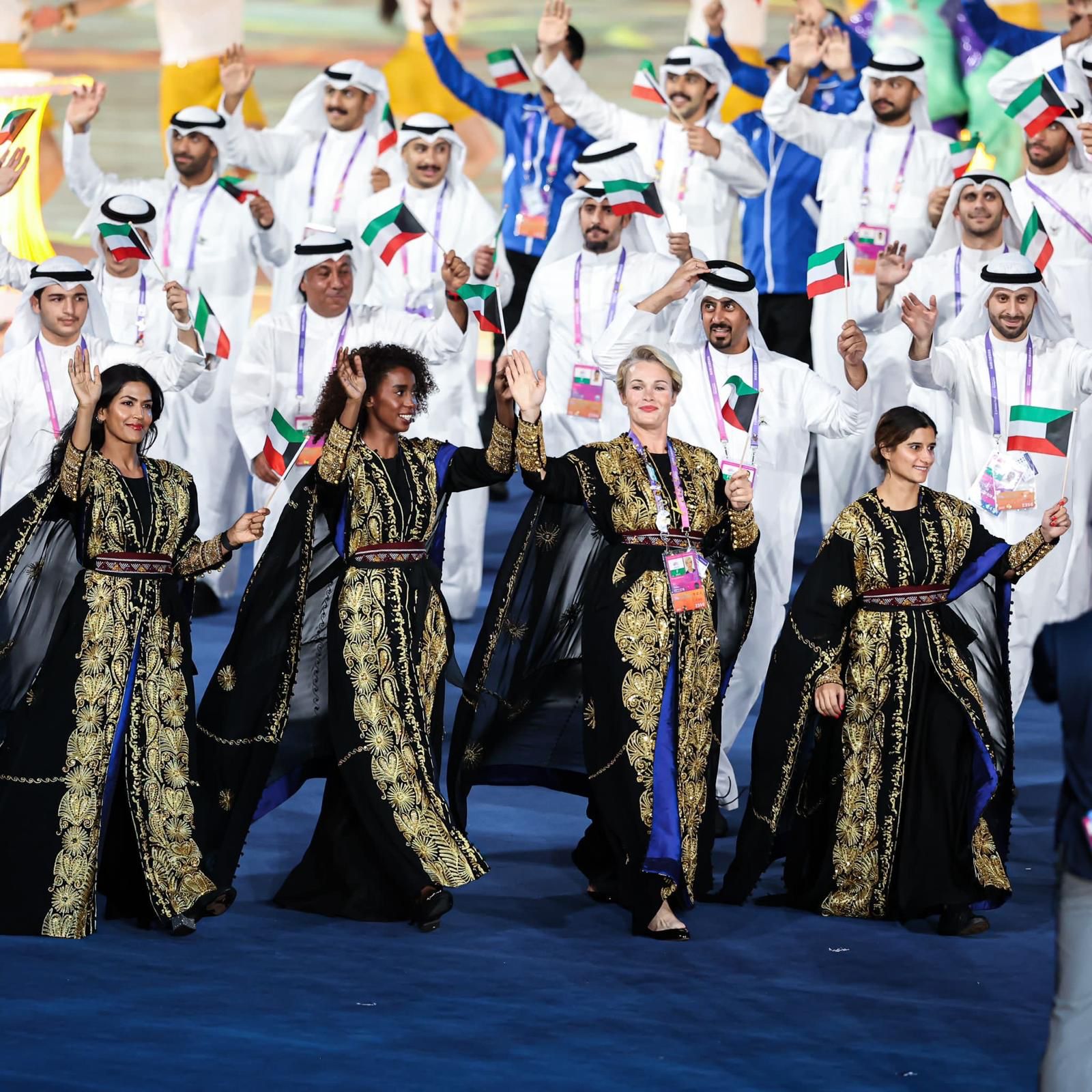 Members of Kuwait's Olympic delegation in embroidered Muhra thoubs at the ceremony