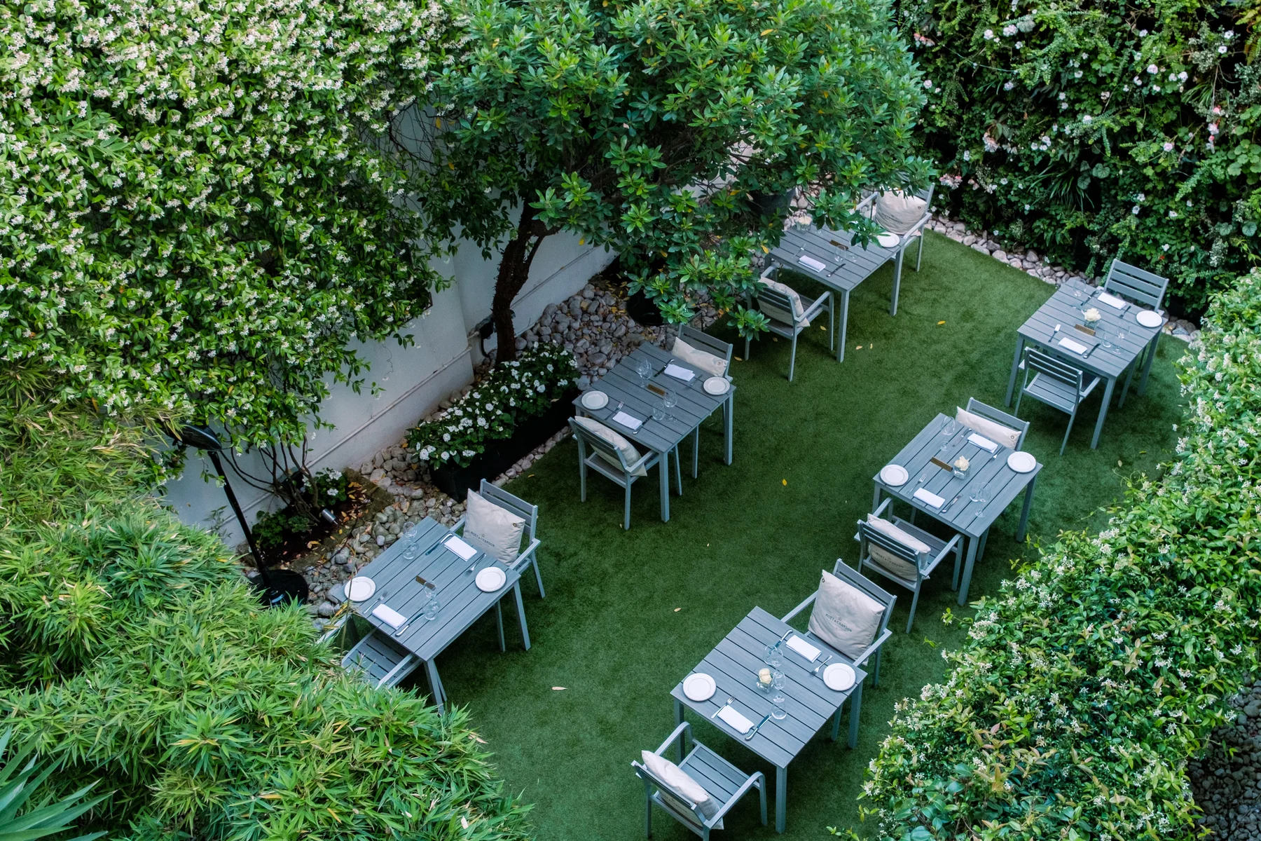 The Hyde Garden set for dining at Roseate House London