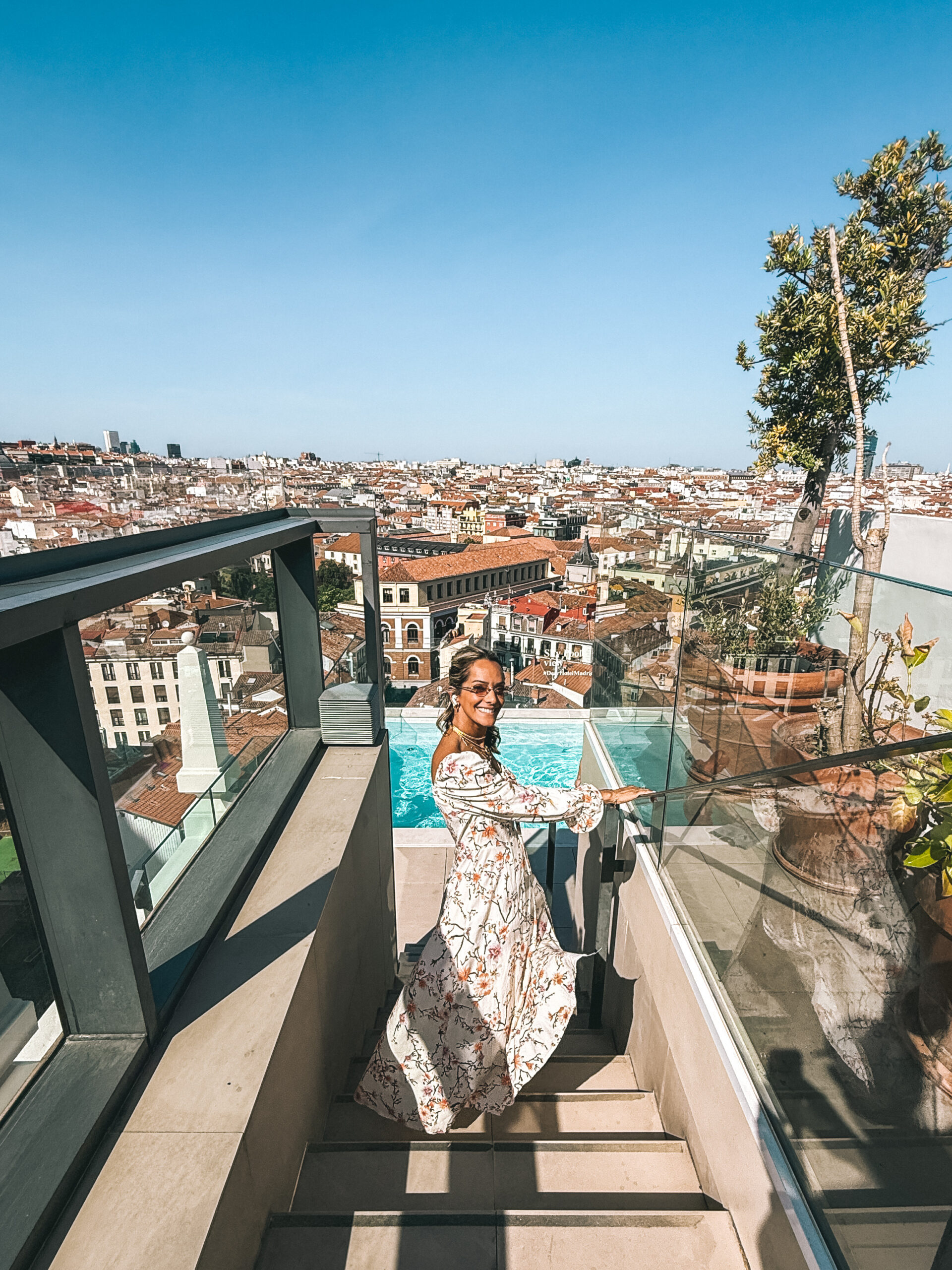 Fatima AlMattar on a rooftop pool above the Madrid skyline