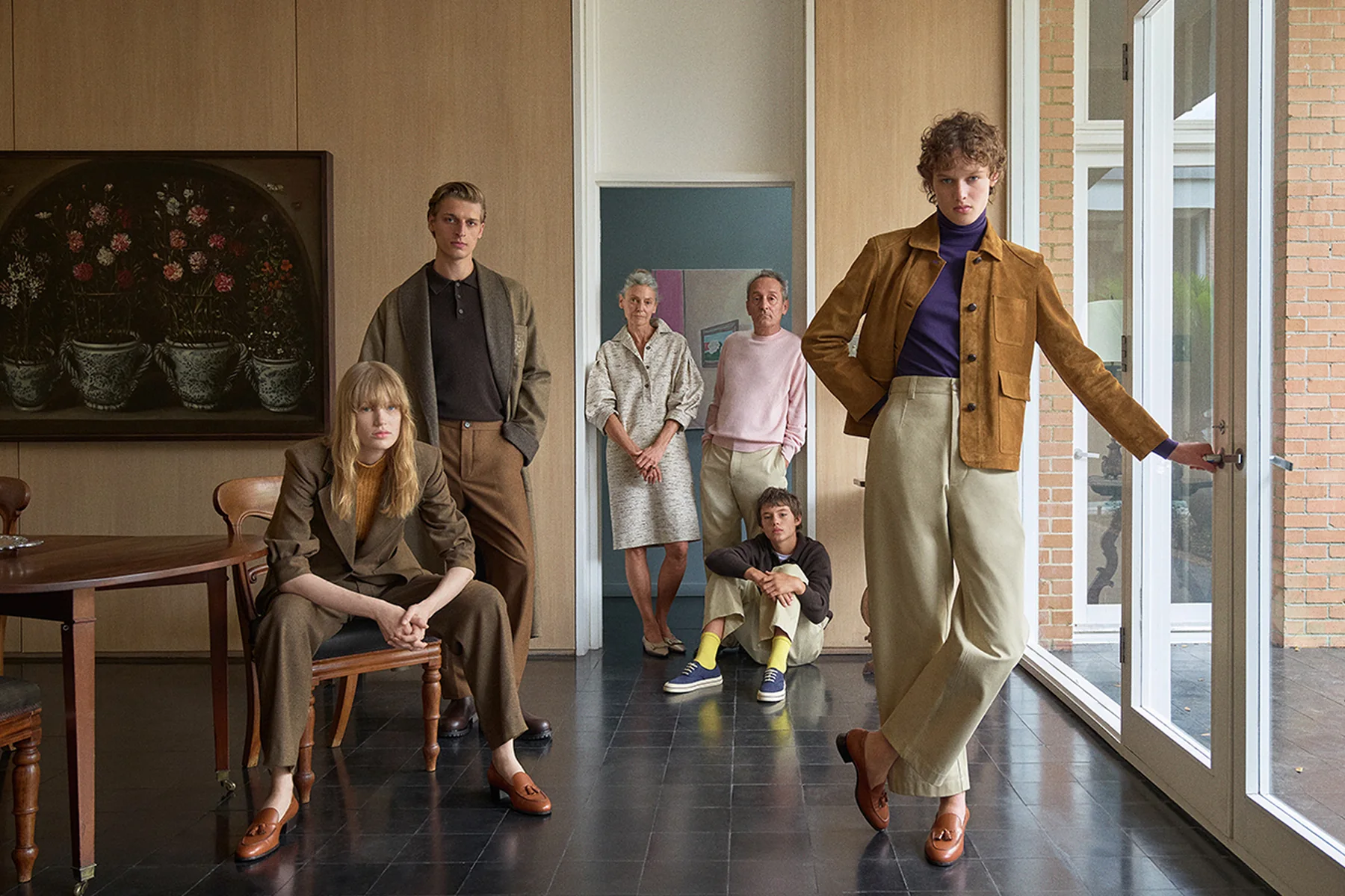 The Loro Piana Fall Winter 2026-2027 cast gathered in a doorway at the Menil Collection, Houston