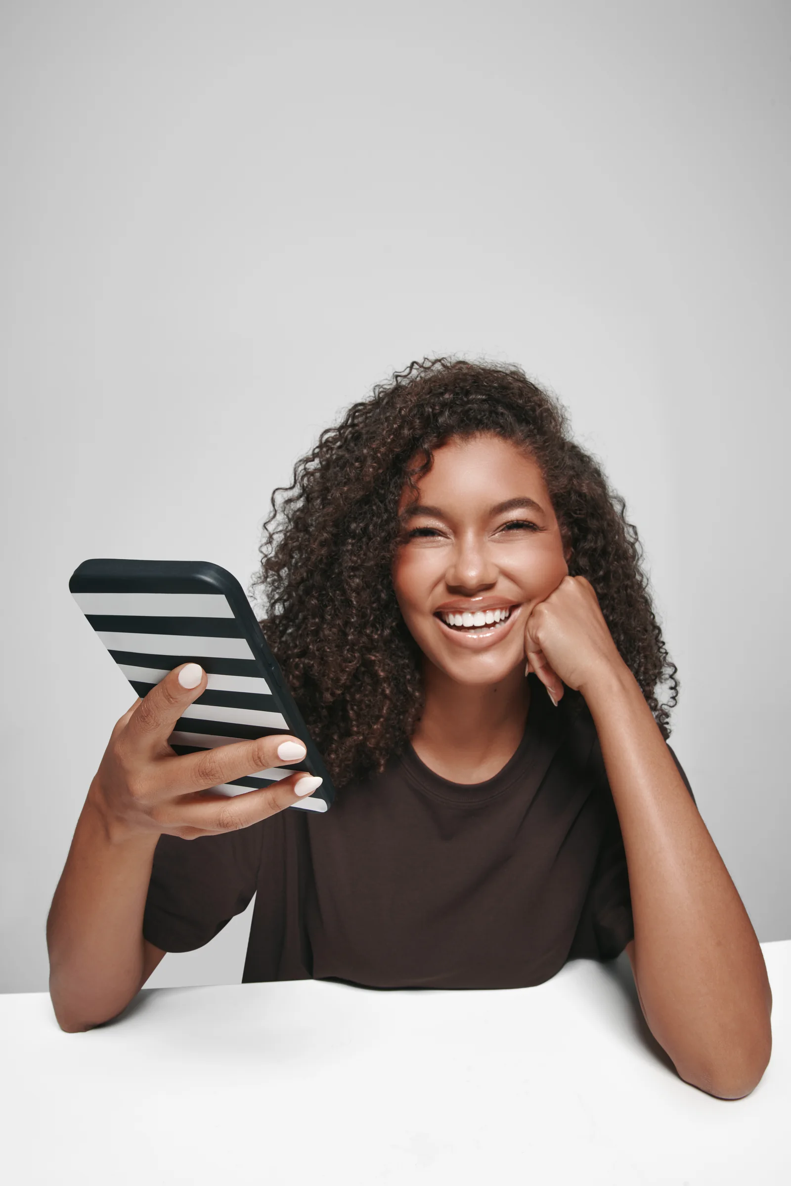 A Sephora shopper checks the Sephora app on her phone