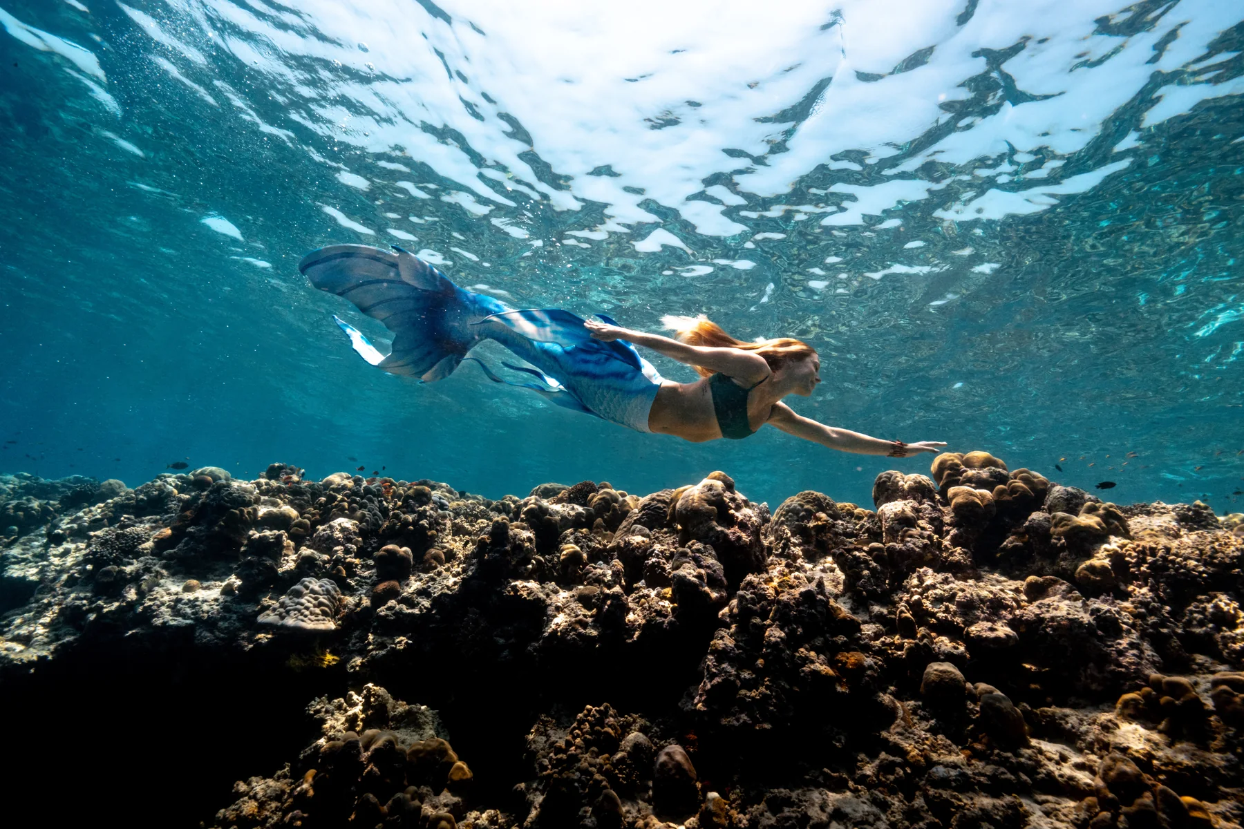 Guest taking part in the Try Mermaid pool programme at Siyam World Maldives