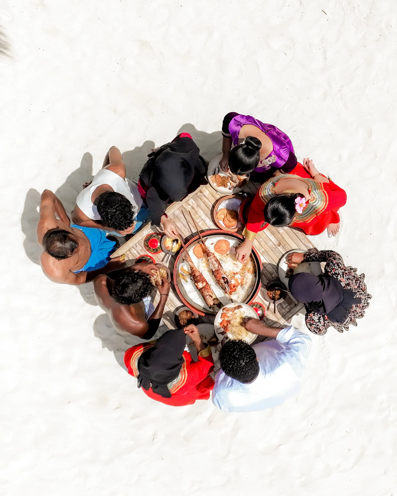 Guests gathering at the Athireege cultural village, Sun Siyam Vilu Reef