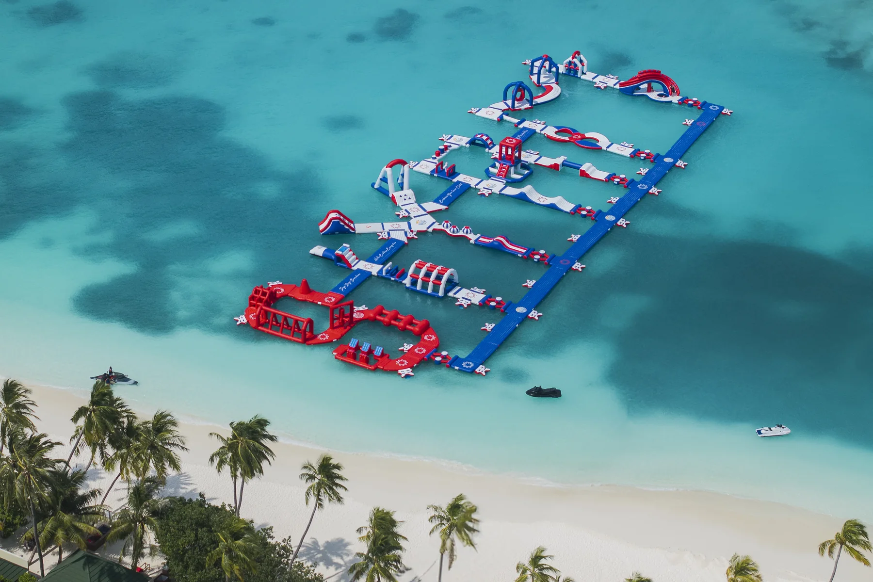 Aerial view of the floating water park and watersports lagoon at Siyam World Maldives