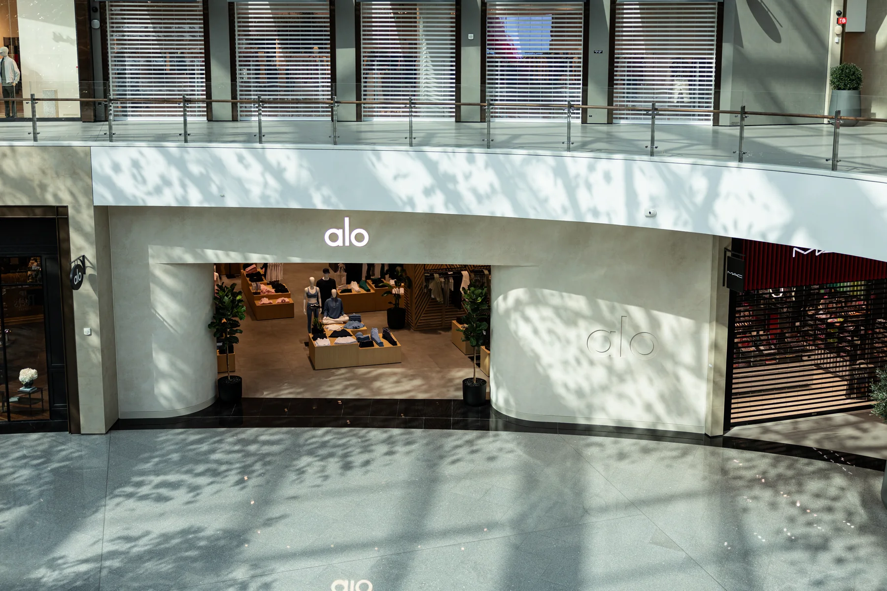 ALO store entrance at Dubai Hills Mall with dappled light