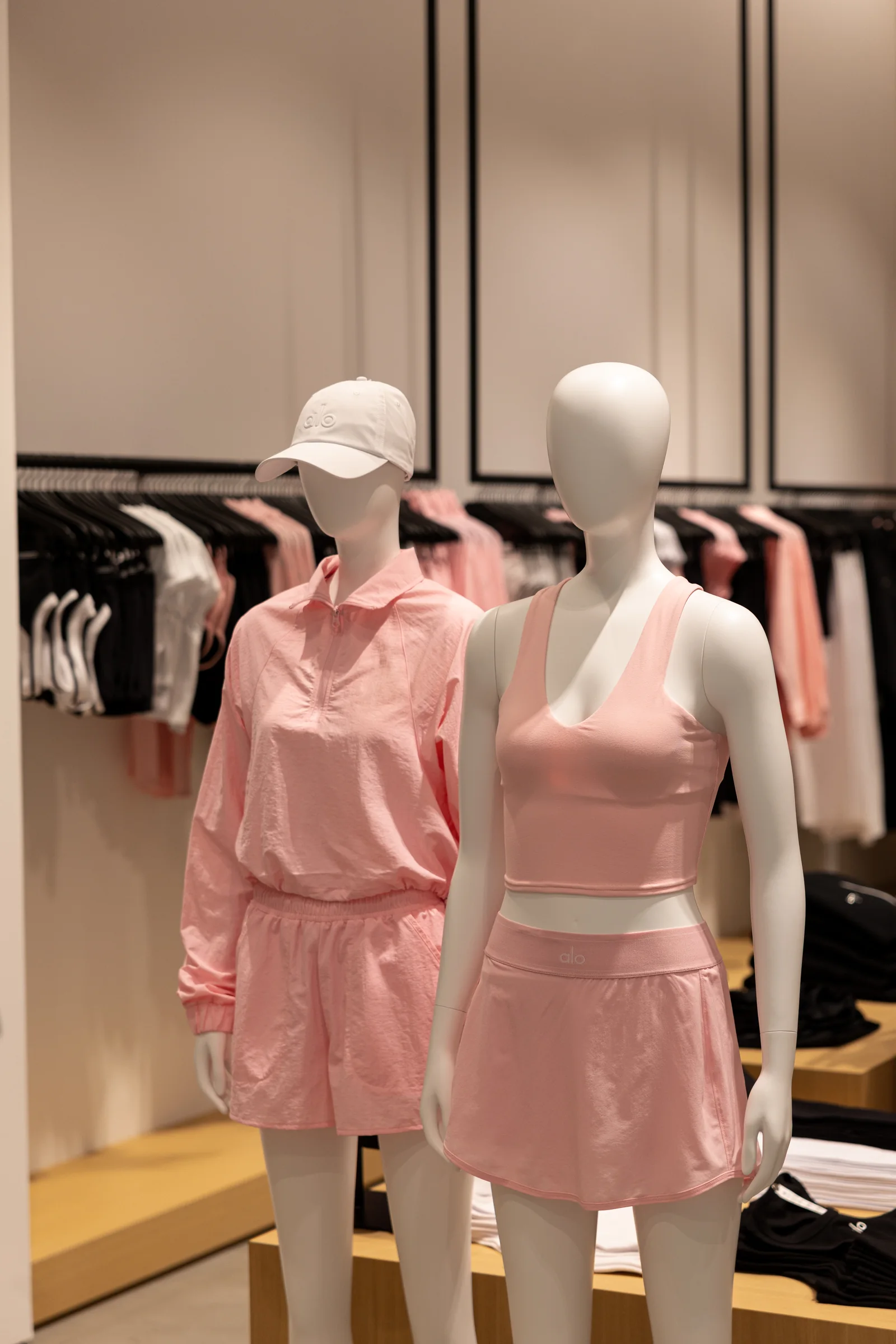Two mannequins in ALO matching activewear sets
