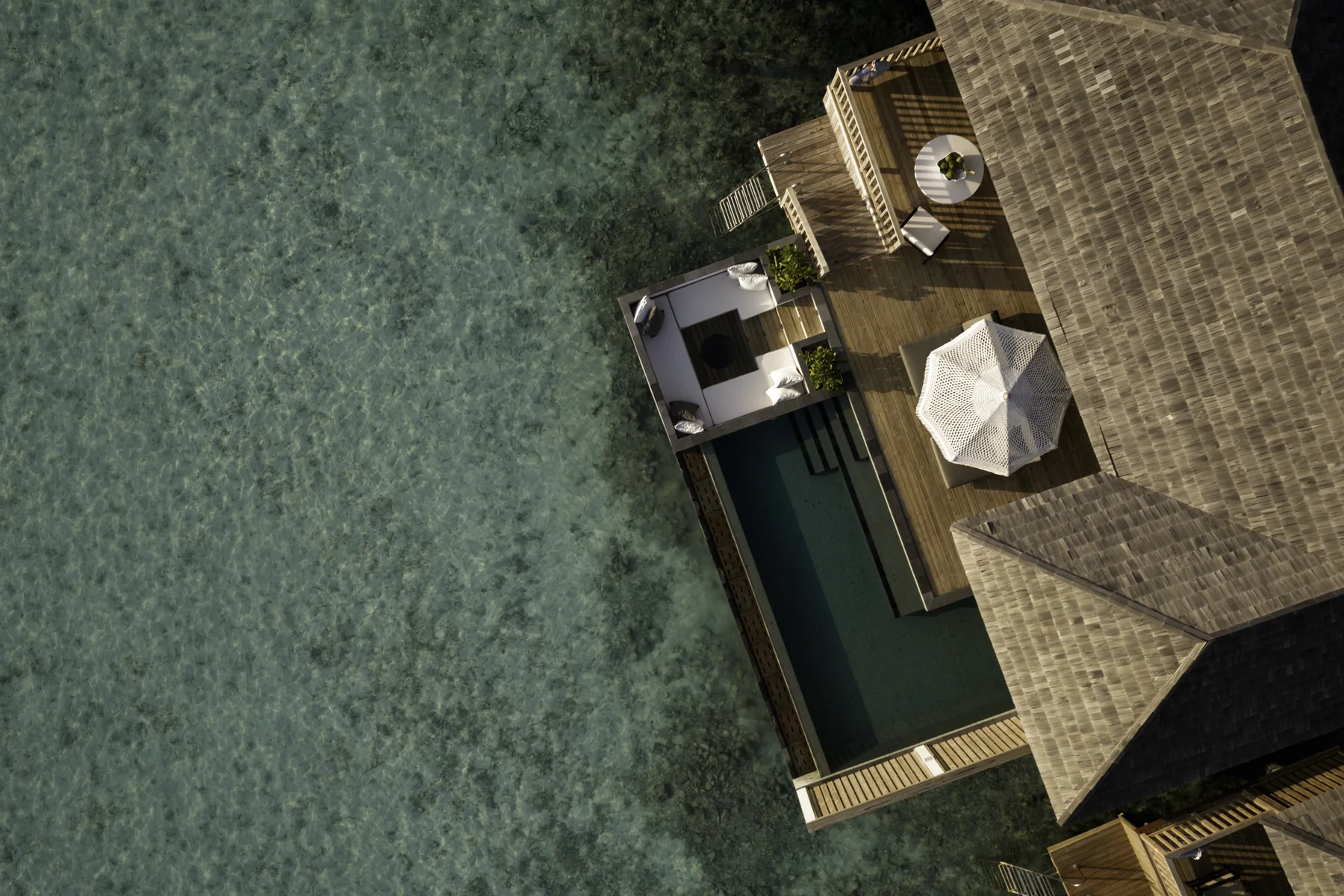 A water villa with private pool at Sun Siyam Iru Fushi, seen from above