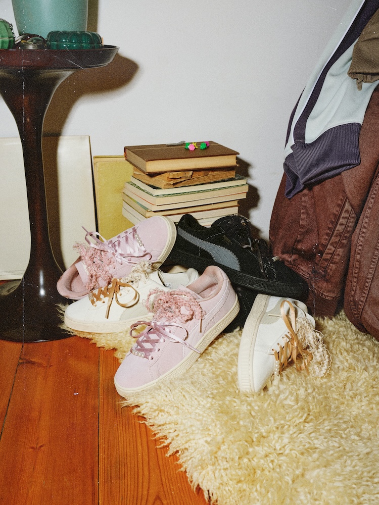 The PUMA Suede Bloom in powder pink, black and cream, with pearl and lace detailing