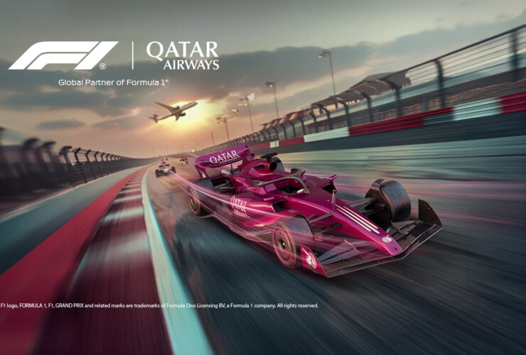 A Qatar Airways liveried Formula 1 car on track, promoting the Qatar Grand Prix 2026 stopover packages