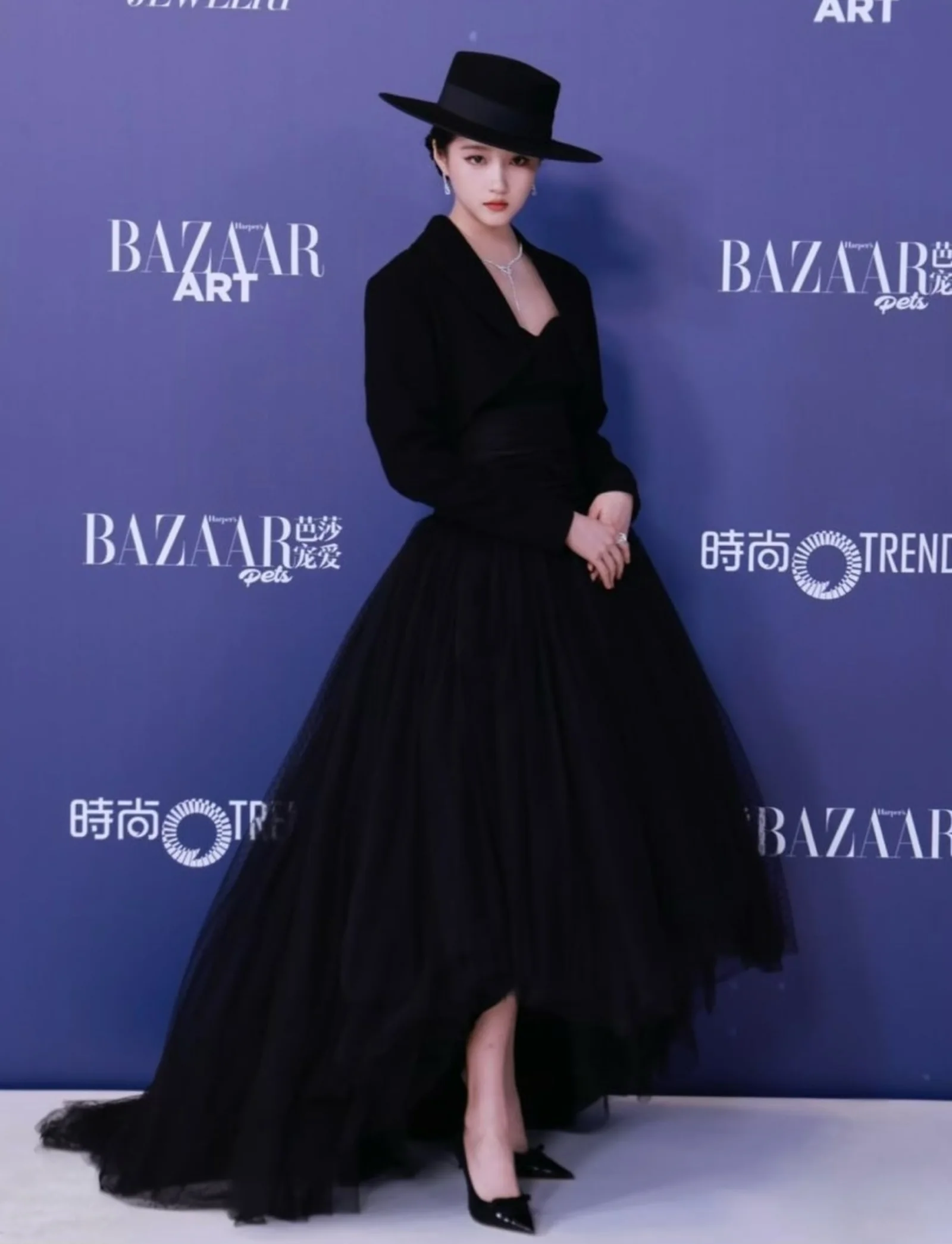 Shahad Albandar in a dramatic black gown and wide-brimmed hat