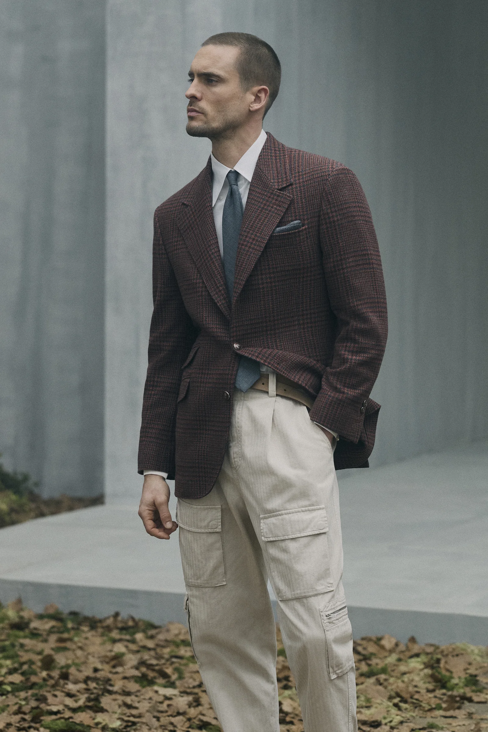 A Brunello Cucinelli burgundy blazer worn with cargo trousers, Fall Winter 2026