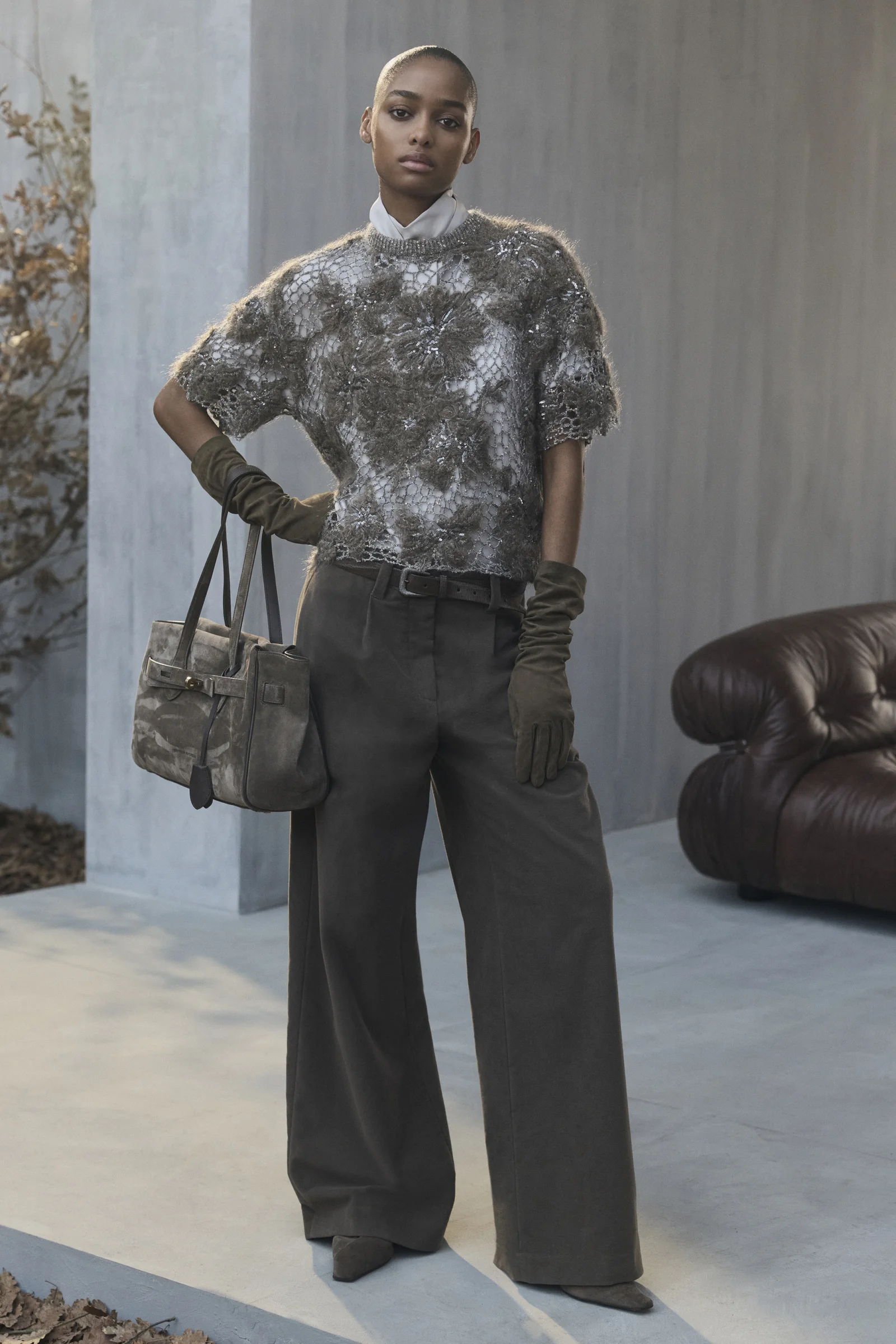 A Brunello Cucinelli animalier knit worn with heritage check trousers, Fall Winter 2026