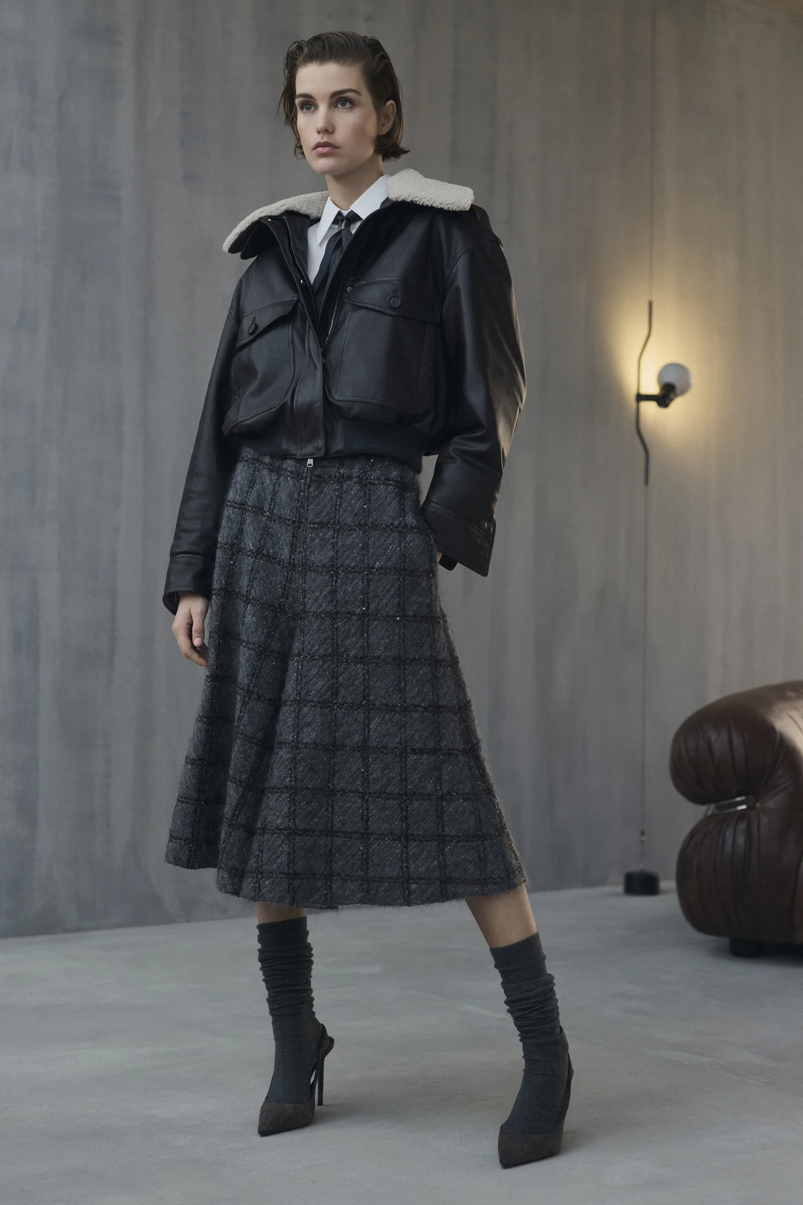 A Brunello Cucinelli check jacket with a pleated midi skirt, Fall Winter 2026