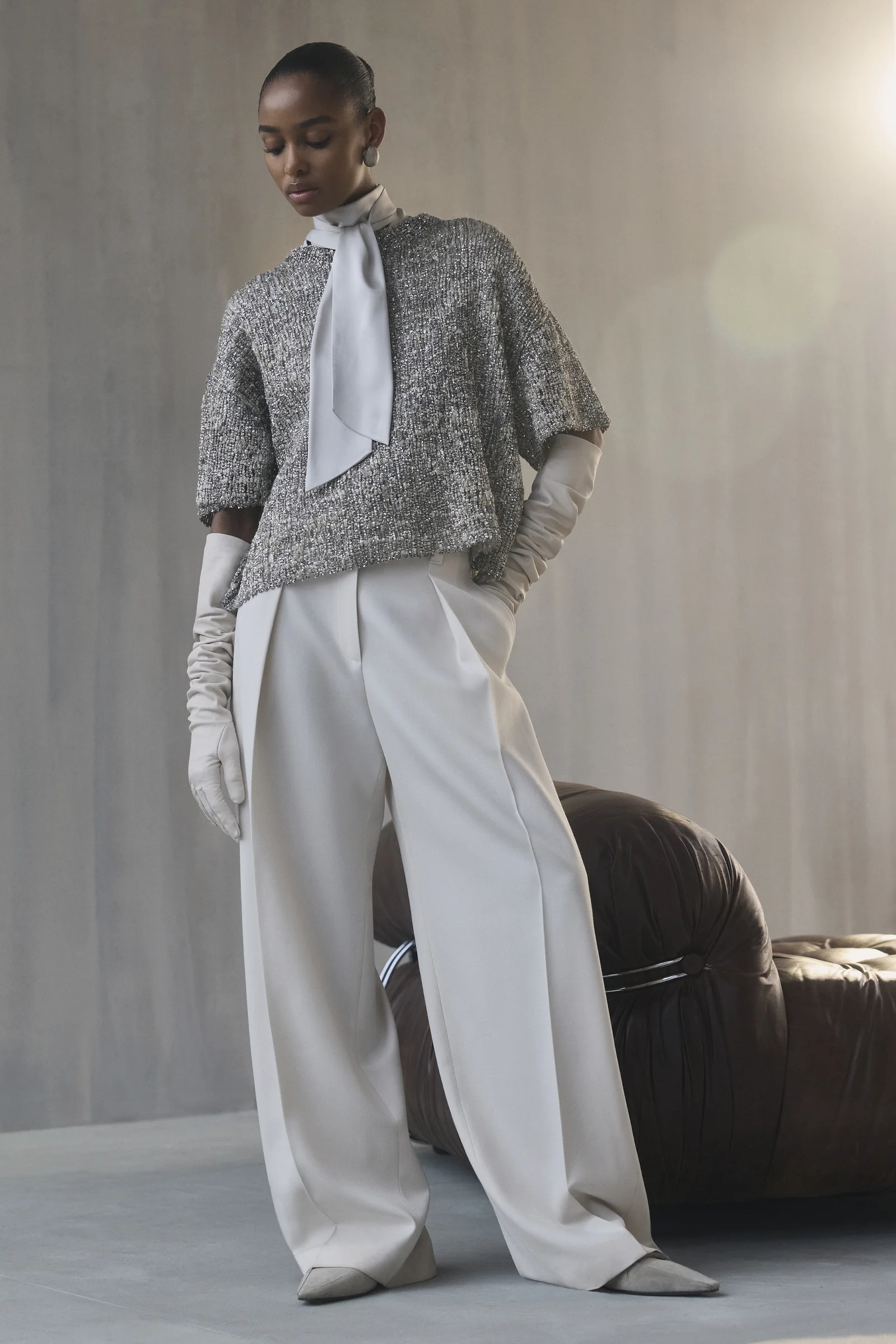 A Brunello Cucinelli textured knit jacket with herringbone trousers, Fall Winter 2026