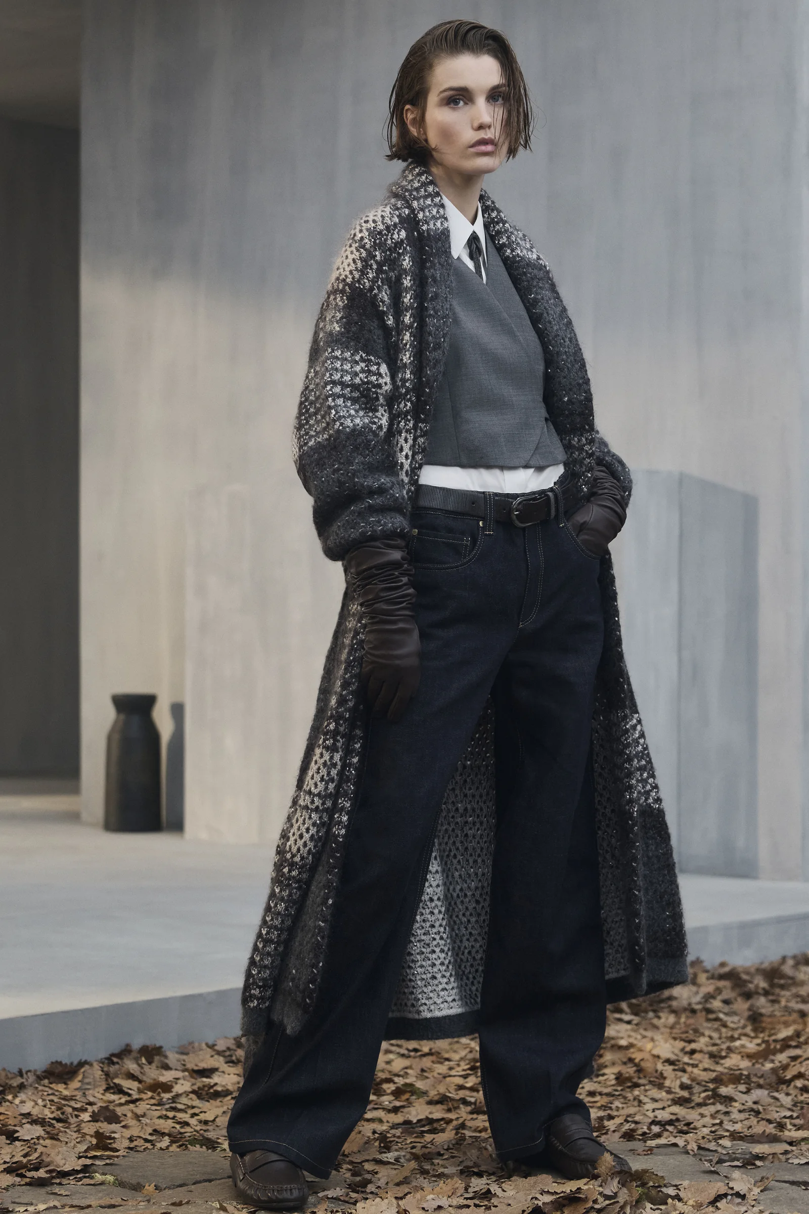 A Brunello Cucinelli Prince of Wales check knit coat over tailoring, Fall Winter 2026