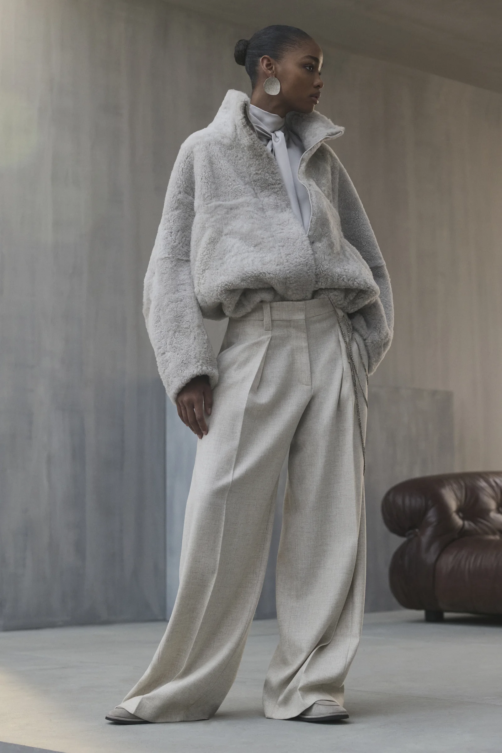 A Brunello Cucinelli shearling jacket with wide trousers, Fall Winter 2026