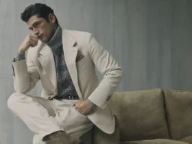 A model in Brunello Cucinelli cream tailoring, Ars Imitatur Naturam Fall Winter 2026 banner