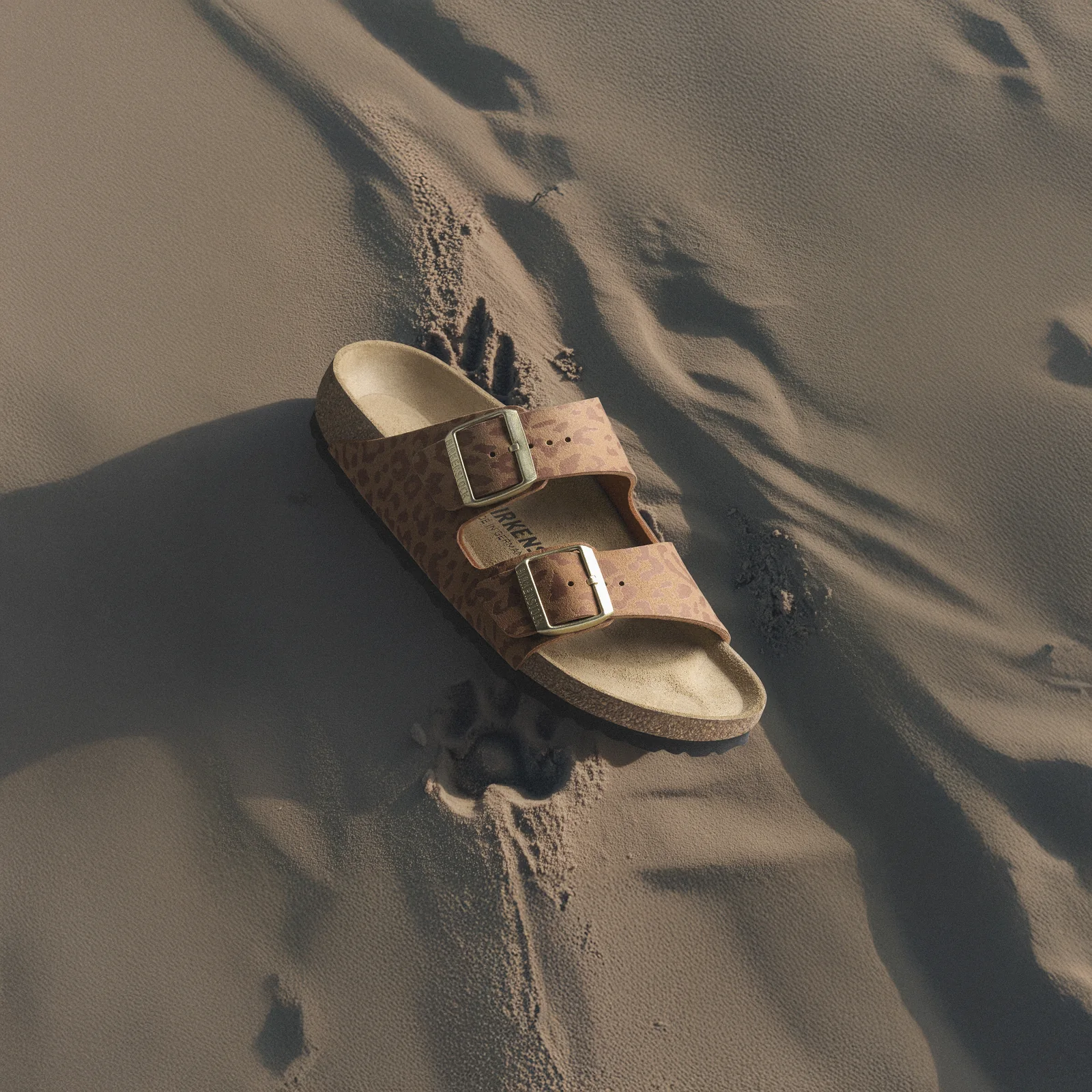 The Birkenstock Arizona in animal-print suede on desert sand