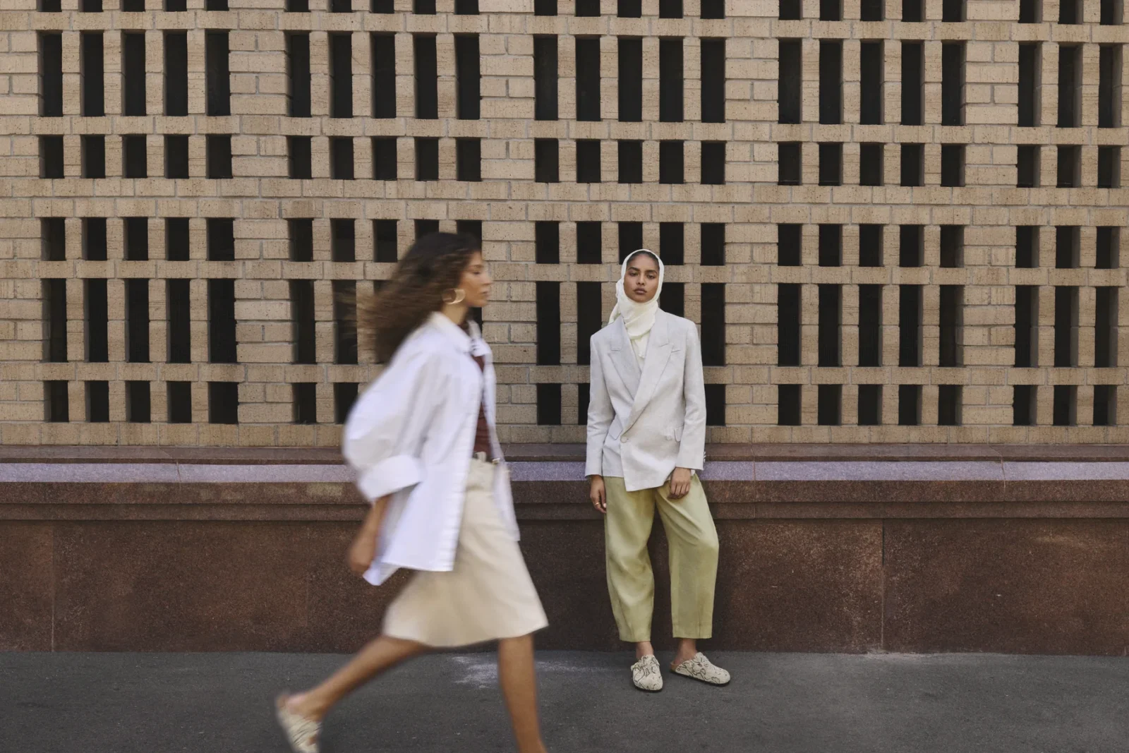Two models walking in Birkenstock Animal Pack sandals, Natural Interaction campaign