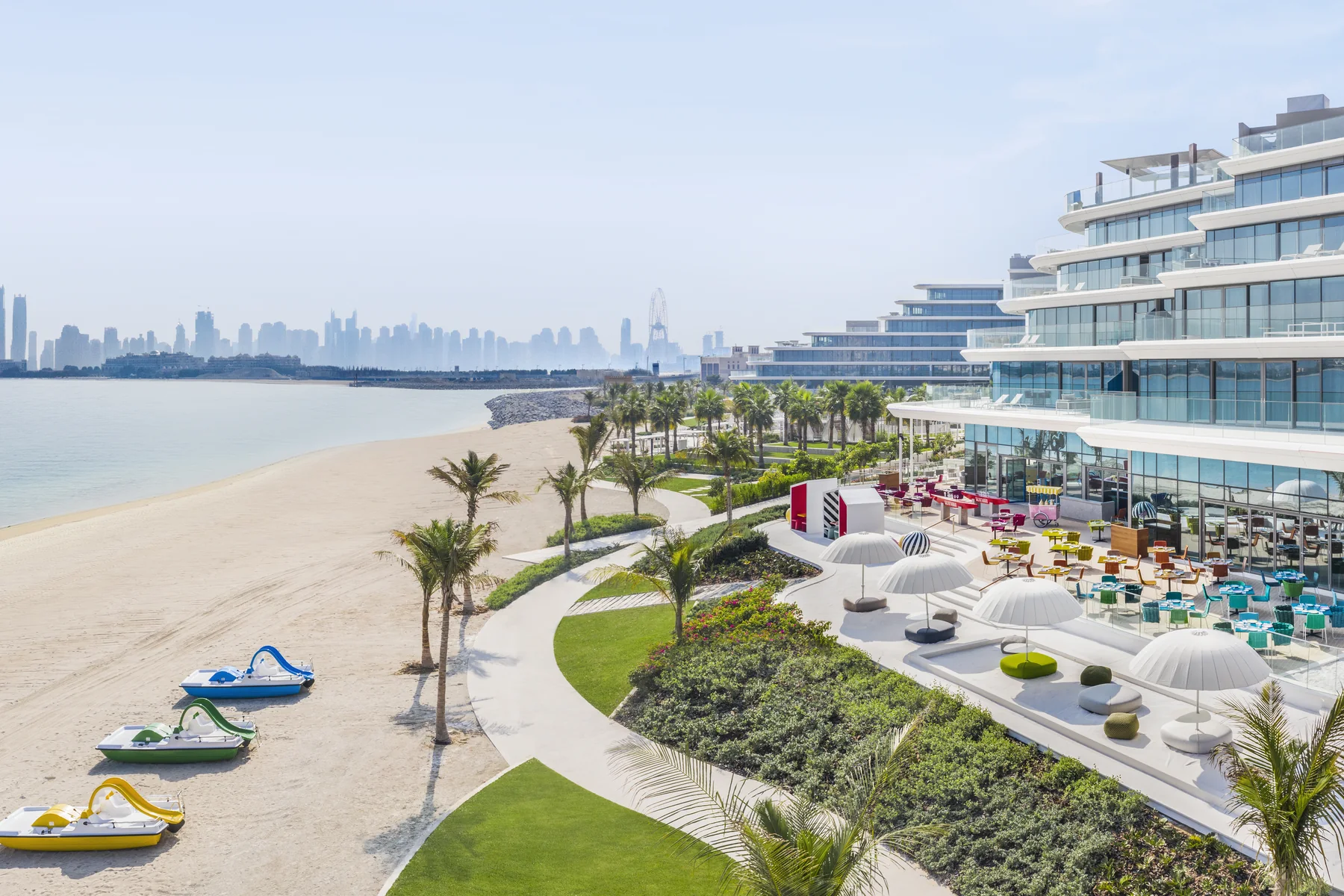 The private beach at W Dubai The Palm with the Dubai skyline beyond