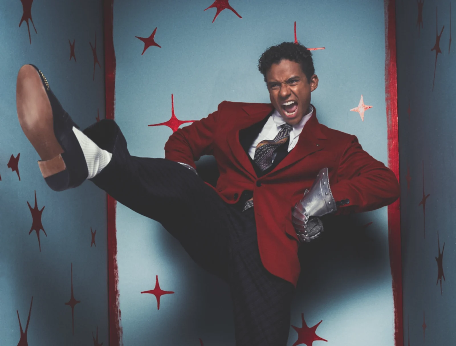 Jaafar Jackson in a red blazer mid-motion for his GQ Middle East September cover shoot