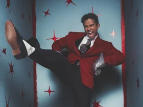 Jaafar Jackson in a red blazer mid-motion for his GQ Middle East September cover shoot