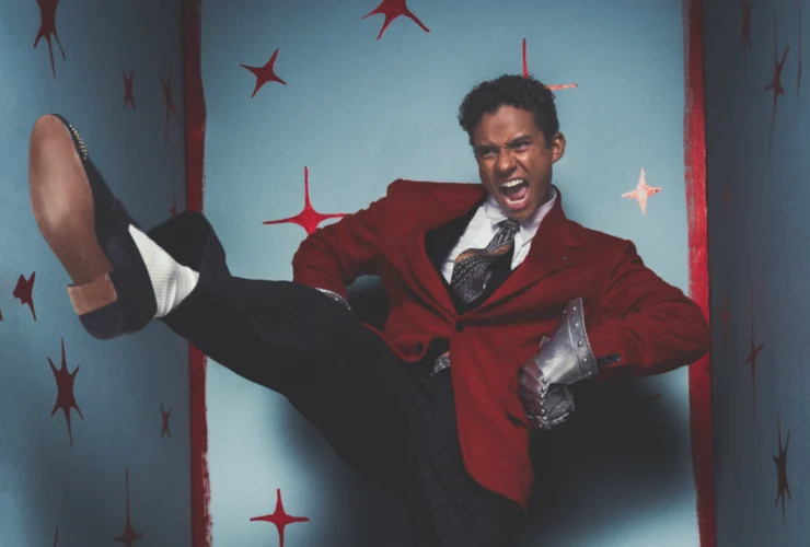 Jaafar Jackson in a red blazer mid-motion for his GQ Middle East September cover shoot