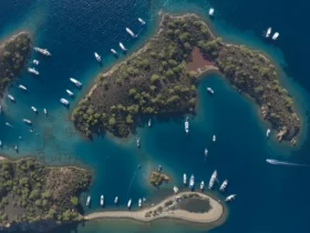 Aerial view of boats anchored in a turquoise Göcek bay on Türkiye's Turquoise Coast
