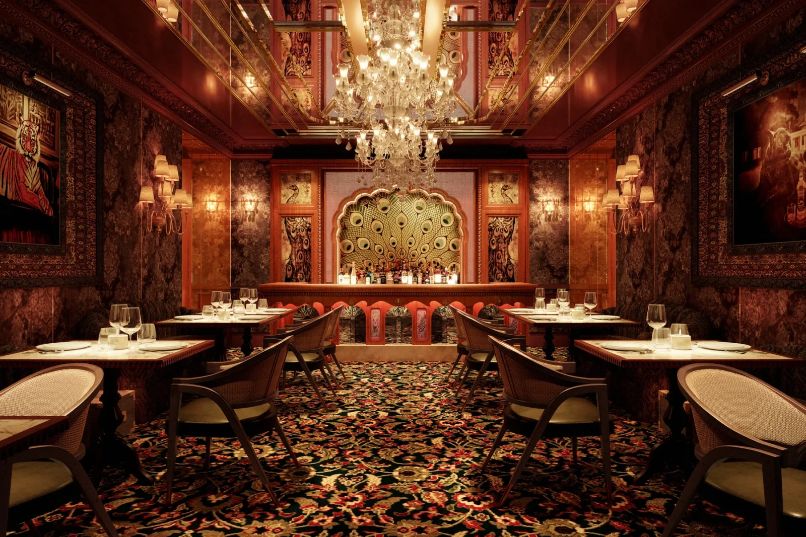 The main dining room at Gymkhana Dubai in DIFC, with chandelier, patterned carpet and stained glass