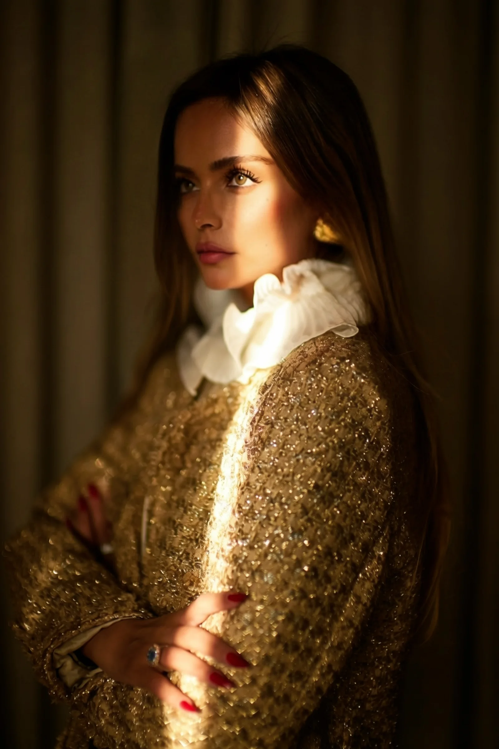 Shahad Albandar in a gold gown with a ruffled collar