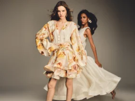 Two models in floral and ivory dresses from BY HAÓ's Jardins de la Cour collection