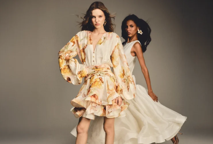 Two models in floral and ivory dresses from BY HAÓ's Jardins de la Cour collection